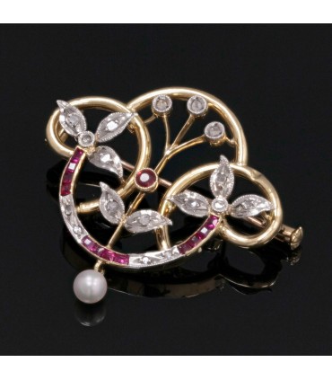 Red stones, pearl, diamonds and gold brooch