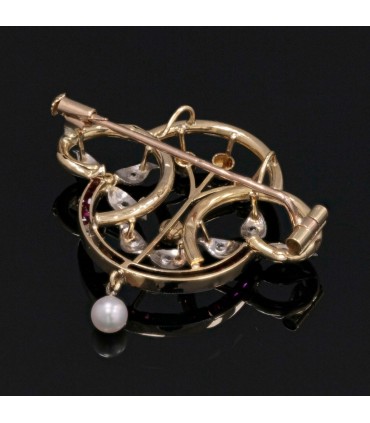 Red stones, pearl, diamonds and gold brooch