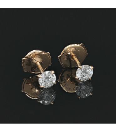 Messika diamonds and gold earrings