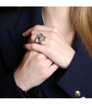 Diamonds, green natural stones and gold ring