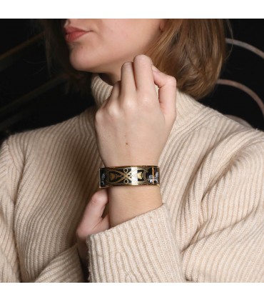 Hermès gold plated metal and enamel bracelet