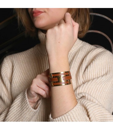 Hermès Pousse-Pousse gold plated metal and leather bracelet