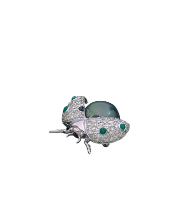 Cultured pearl, emeralds, onyx, diamonds and gold brooch