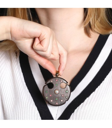 Wood, fine stones and gold pendant