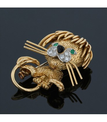 Van Cleef & Arpels Lion Ebouriffé gold, platinum, diamonds, emeralds and enamel brooch
