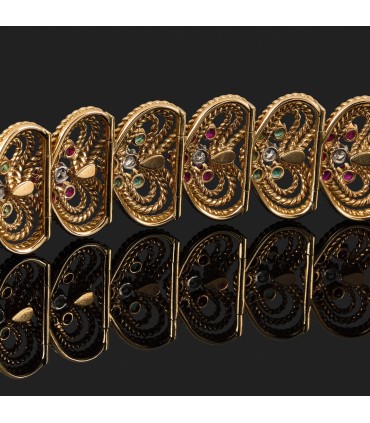 Rubies, emeralds, diamonds and gold bracelet.