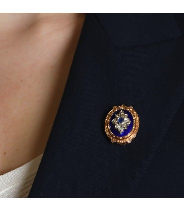 Gold, enamel, diamonds and sapphire brooch