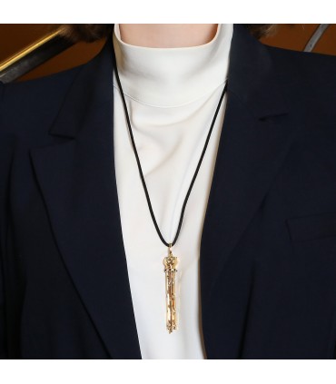 Cartier Panthère gold, onyx, garnets and diamonds pendant